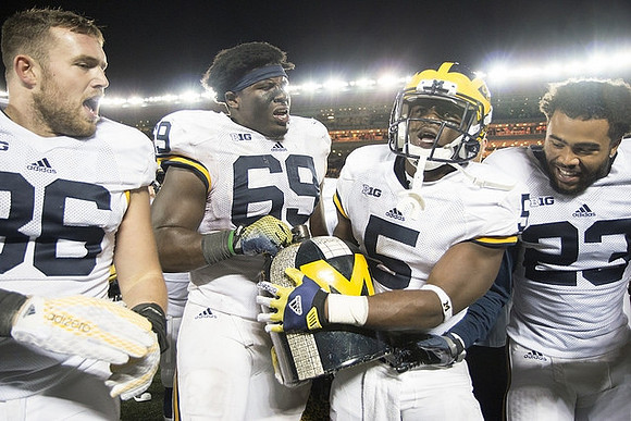 Joe Kerridge (36), Willie Henry (69), Jabrill Peppers (5), Tyree Kinnel (23), and The Little Brown Jug