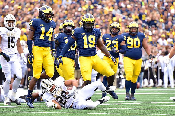 Josh Metellus (14), Devin Bush (10), Kwity Paye (19), Tyree Kinnel (23), and Bryan Mone (90)