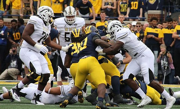 Devin Gil (36) and Devin Bush (10)