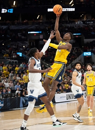 Moussa Diabate (14) and Brandon Johns Jr. (23)