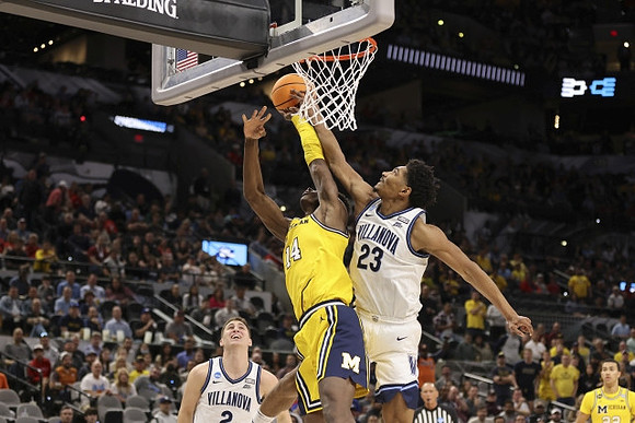 Moussa Diabate (14) and Caleb Houstan (22)
