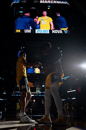 Caleb Houstan (22) and Michigan Team