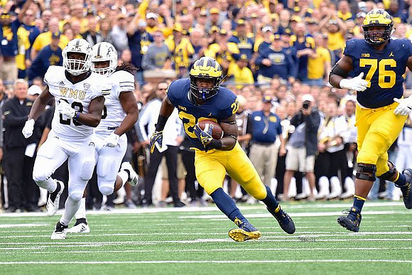 Karan Higdon (22) and Juwann Bushell-Beatty (76)