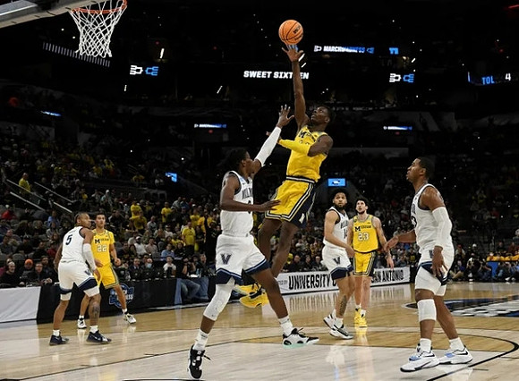 Moussa Diabate (14), Caleb Houstan (22), and Brandon Johns Jr. (23)