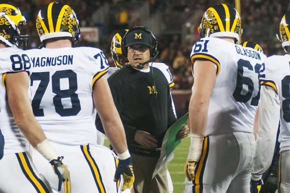 Jake Butt (88), Erik Magnuson (78), Jim Harbaugh, and Graham Glasgow (61)