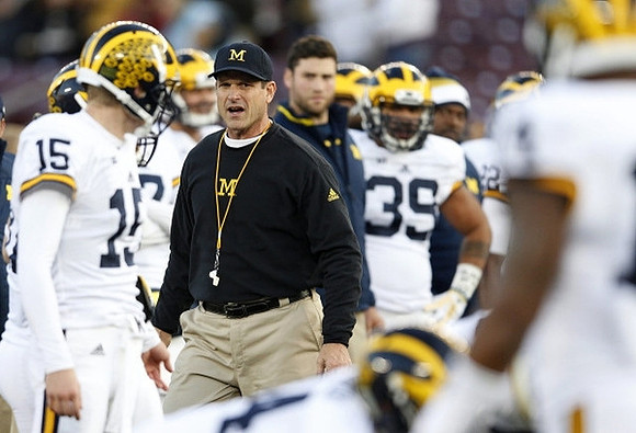 Jim Harbaugh, Jake Rudock (15), and Sione Houma (39)