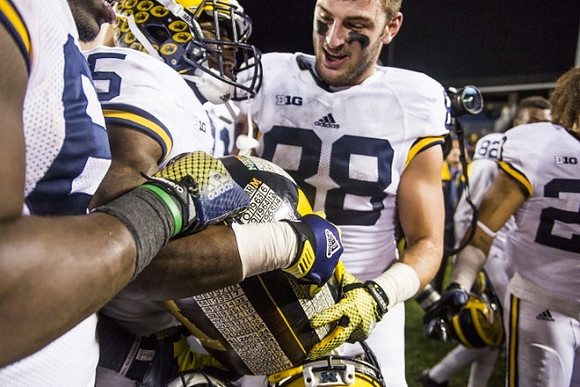 Jabrill Peppers (5), Jake Butt (88), and The Little Brown Jug