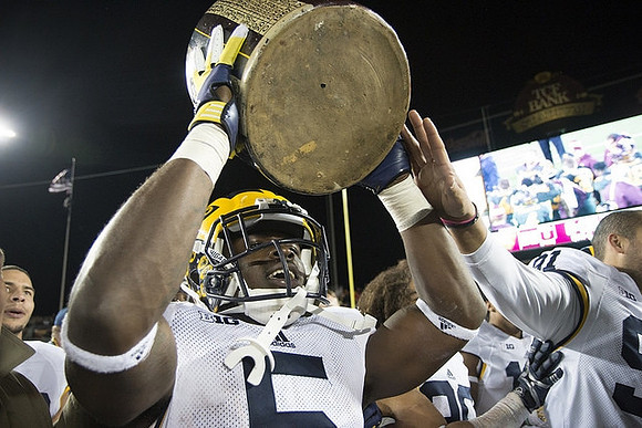 Jabrill Peppers (5), Kenny Allen (91), and The Little Brown Jug