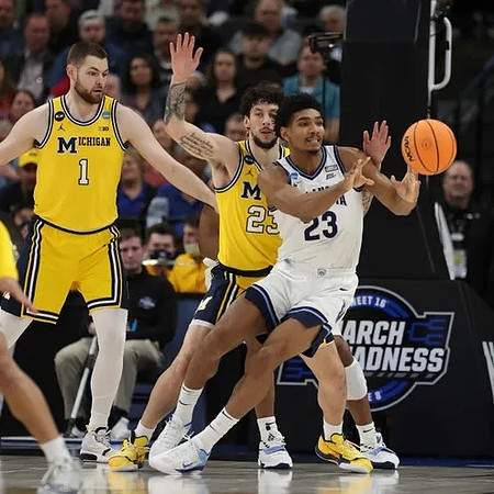 Hunter Dickinson (1) and Brandon Johns Jr. (23)