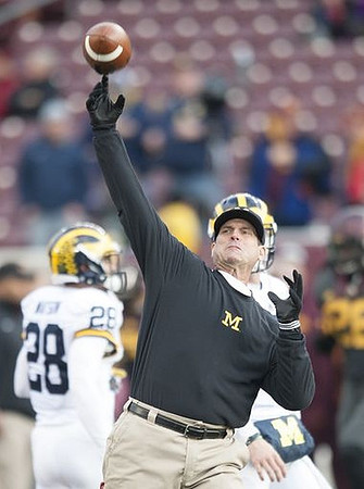 Brandon Watson (28) and Jim Harbaugh