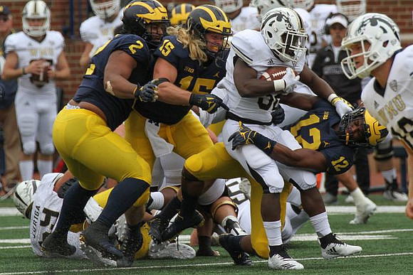 Carlo Kemp (2), Chase Winovich (15), and Josh Ross (12)