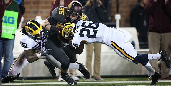 Jarrod Wilson (22) and Jourdan Lewis (26)