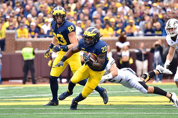 Zach Gentry (83) and Karan Higdon (22)