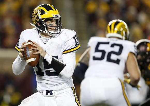 Jake Rudock (15) and Mason Cole (52)