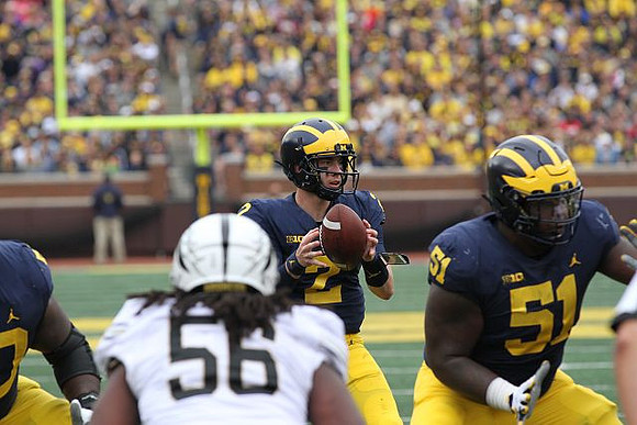 Shea Patterson (2) and Cesar Ruiz (51)