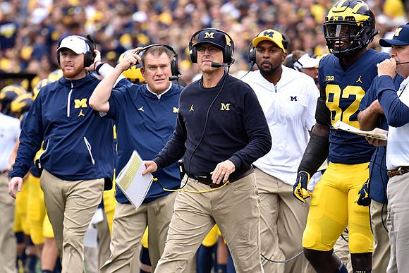Jim Harbaugh and Nick Eubanks (82)