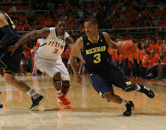 Jordan Morgan (52) and Trey Burke (3)