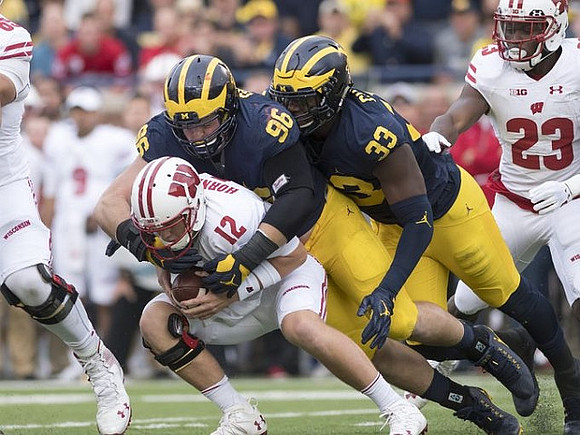 Ryan Glasgow (96) and Taco Charlton (33)