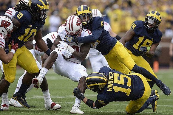 Devin Bush (10), Keith Washington (6), Chase Winovich (15), and AJ Pearson (18)