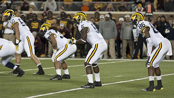 Tom Strobel (50), Sione Houma (39), Jabrill Peppers (5), and Jehu Chesson (86)