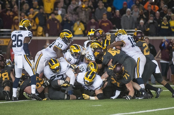 Jourdan Lewis (26), Taco Charlton (33), Tyree Kinnel (23), Desmond Morgan (3), Willie Henry (69), Ryan Glasgow (96), Joe Bolden (35), and James Ross (15)