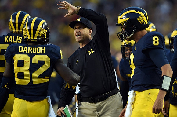 Kyle Kalis (67), Amara Darboh (82), Jim Harbaugh, and John O'Korn (8)