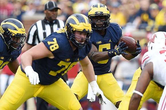 Erik Magnuson (78) and Jabrill Peppers (5)