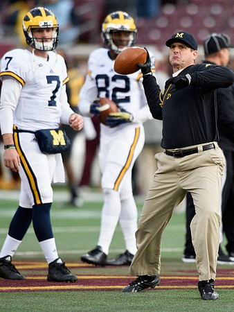 Shane Morris (7), Amara Darboh (82), and Jim Harbaugh