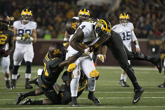 Jake Butt (88), De'Veon Smith (4), and Jake Rudock (15)