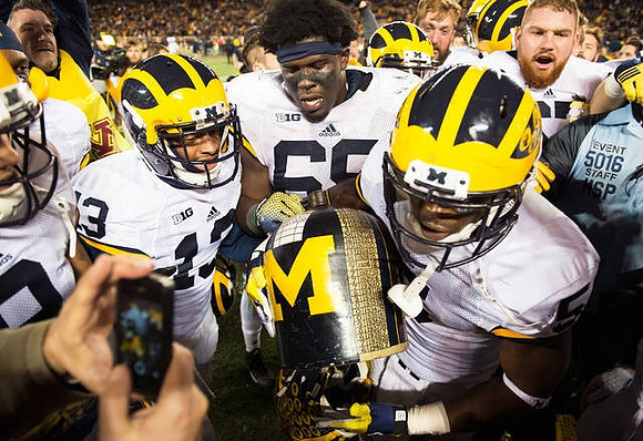 Terry Richardson (13), Willie Henry (69), Jabrill Peppers (5), Kyle Kalis (67), and The Little Brown Jug