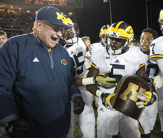 Jon Falk, Maurice Ways (85), Jabrill Peppers (5), Da'Mario Jones (10), Shane Morris (7), and The Little Brown Jug
