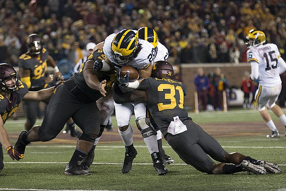 Drake Johnson (20), Graham Glasgow (61), and Jake Rudock (15)