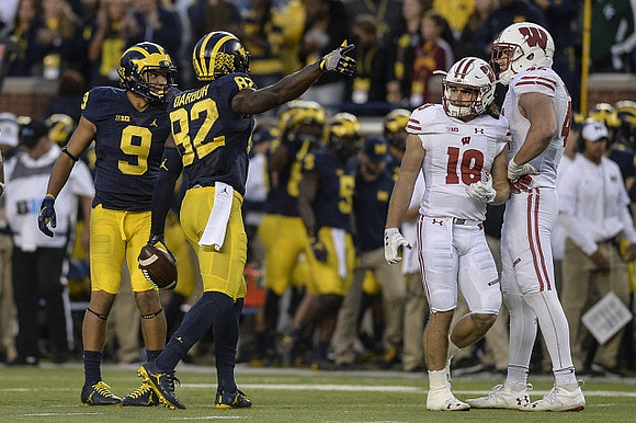 Grant Perry (9) and Amara Darboh (82)