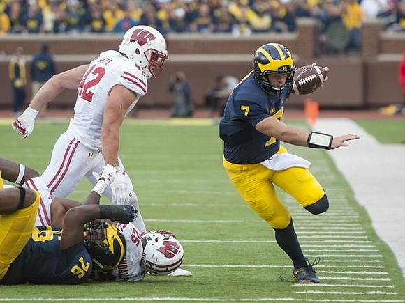 Juwann Bushell-Beatty (76) and Shane Morris (7)