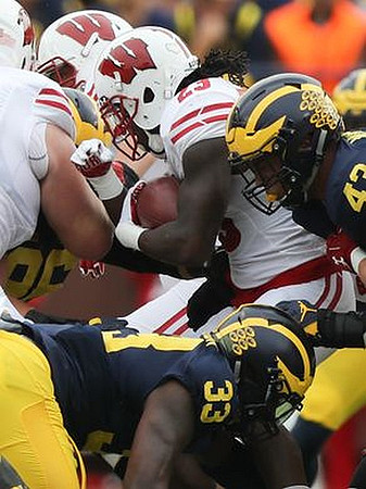 Ryan Glasgow (96), Taco Charlton (33), and Chris Wormley (43)