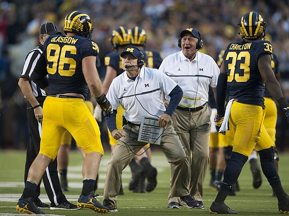 Ryan Glasgow (96), Don Brown, Greg Mattison, and Taco Charlton (33)