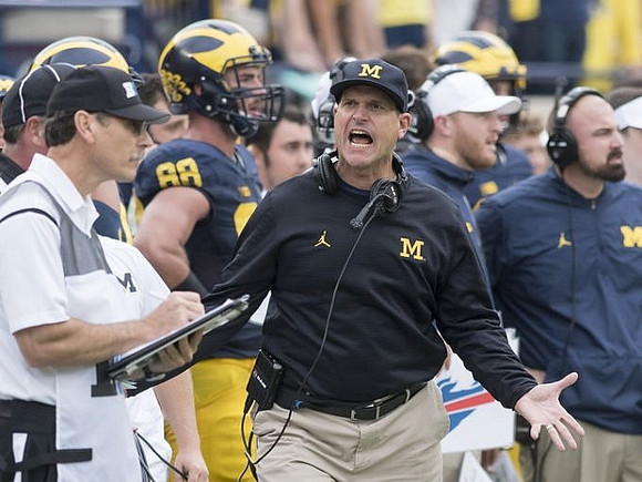 Jake Butt (88), Jim Harbaugh, Jay Harbaugh, and Chris Partridge