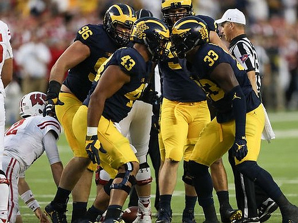 Ryan Glasgow (96), Chris Wormley (43), Matthew Godin (99), and Taco Charlton (33)
