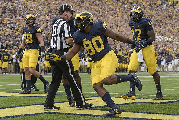 Jake Butt (88), Khalid Hill (80), and Tyrone Wheatley Jr. (17)