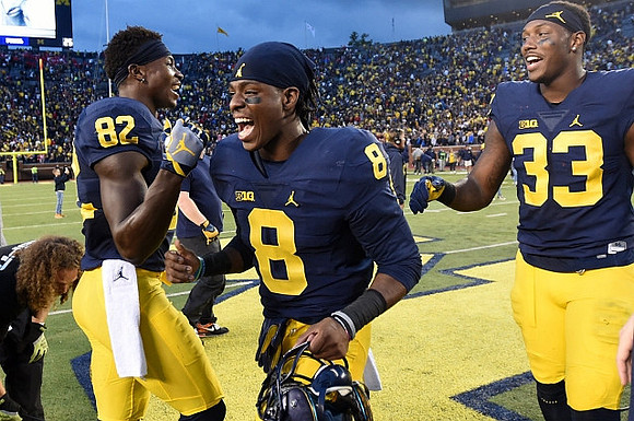 Amara Darboh (82), Channing Stribling (8), and Taco Charlton (33)