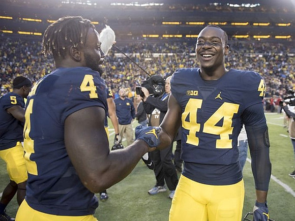 De'Veon Smith (4) and Delano Hill (44)