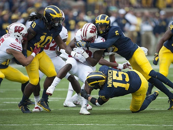 Devin Bush (10), Chase Winovich (15), and Keith Washington (6)