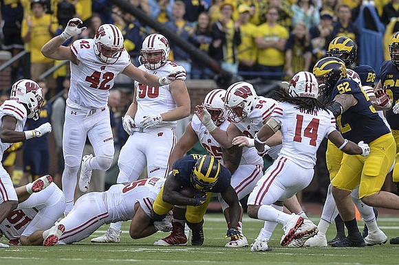 De'Veon Smith (4), Mason Cole (52), Jake Butt (88), and Kyle Kalis (67)