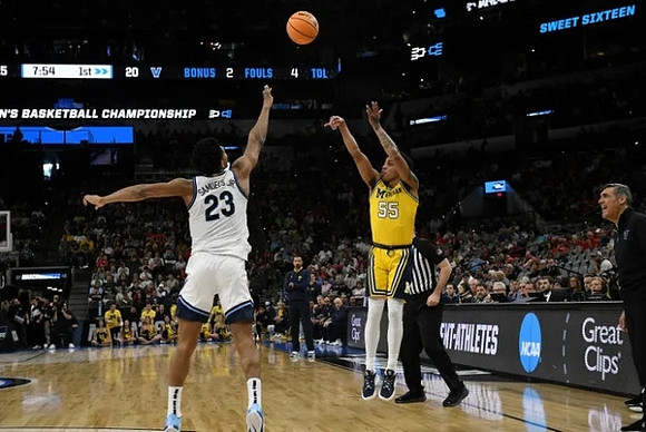 Eli Brooks (55) and Villanova Head Coach Jay Wright