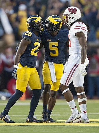 Jourdan Lewis (26) and Jabrill Peppers (5)