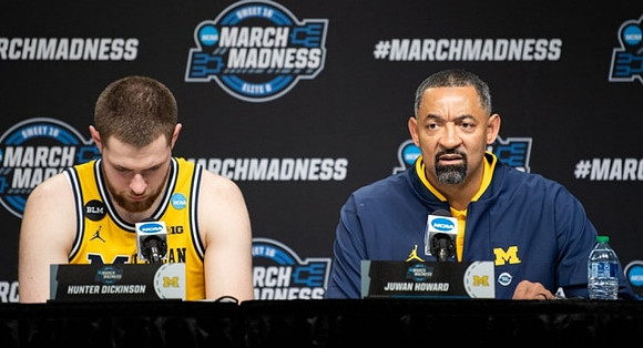 Hunter Dickinson (1) and Juwan Howard