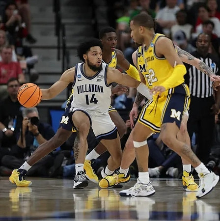 Moussa Diabate (14) and DeVante' Jones (12)