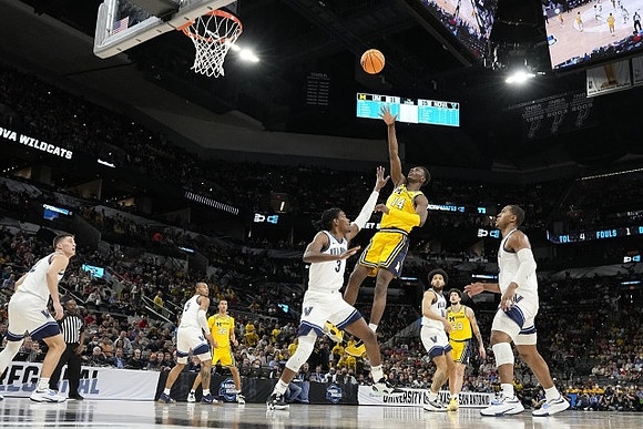 Moussa Diabate (14), Caleb Houstan (22), and Brandon Johns Jr. (23)