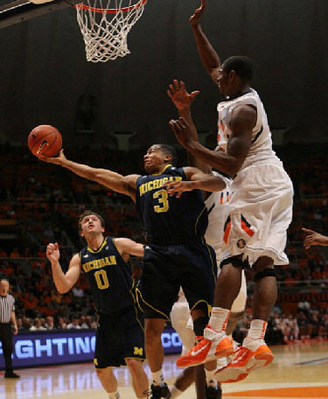 Zack Novak (0) and Trey Burke (3)