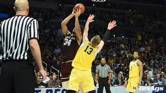 Moritz Wagner (13) and Zavier Simpson (3)